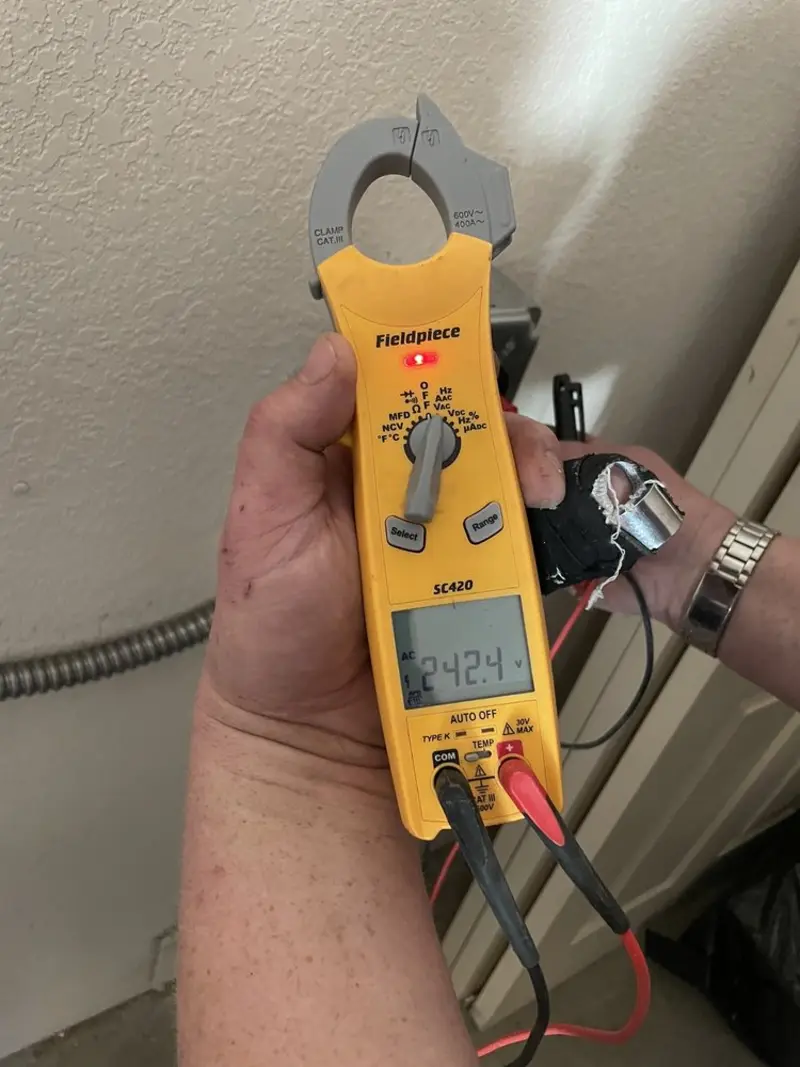 Voltage testing with clamp meter during Outlet Installation in Red Bank